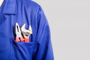 tools-in-front-pocket-of-blue-work-shirt